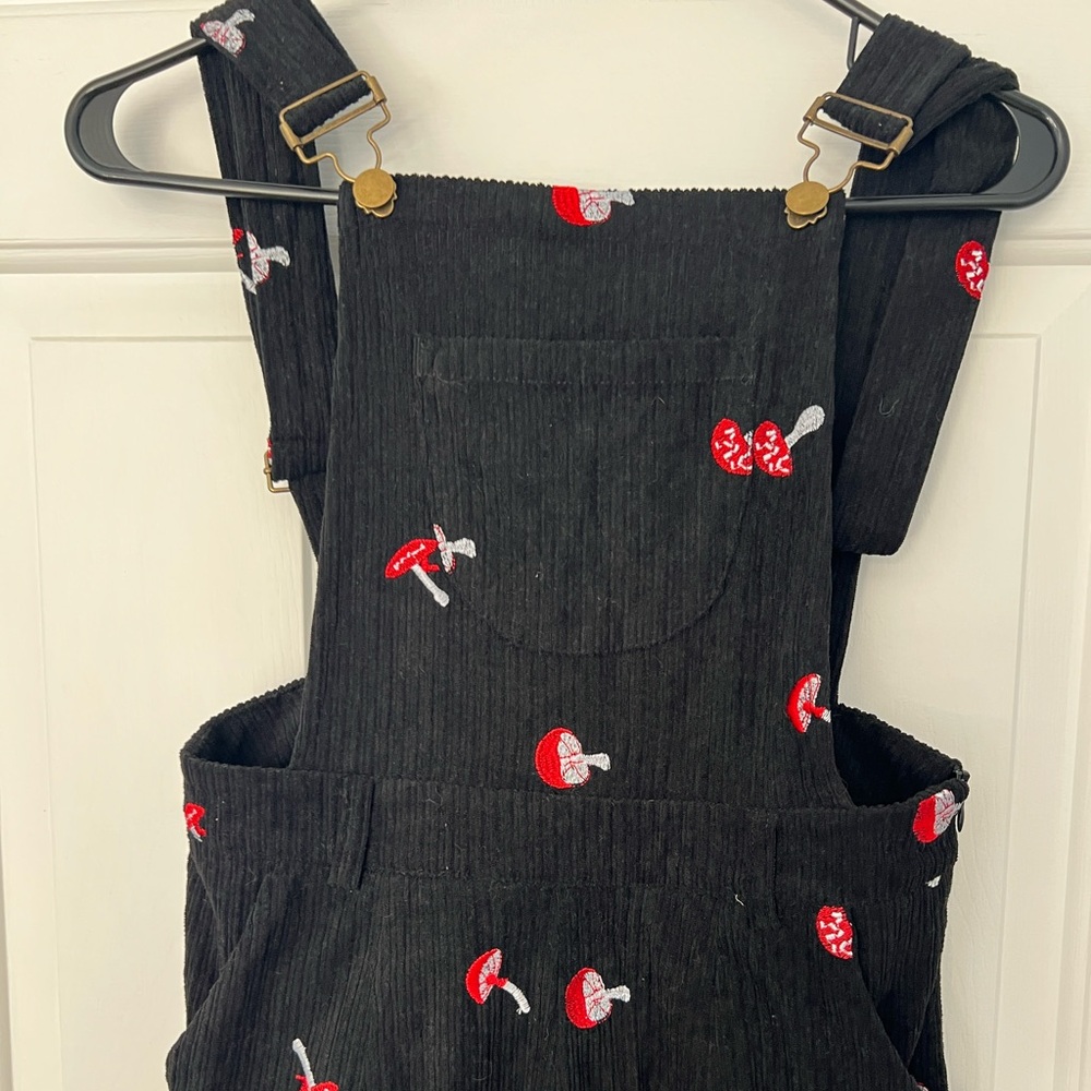 Black overalls with mushrooms and pockets
